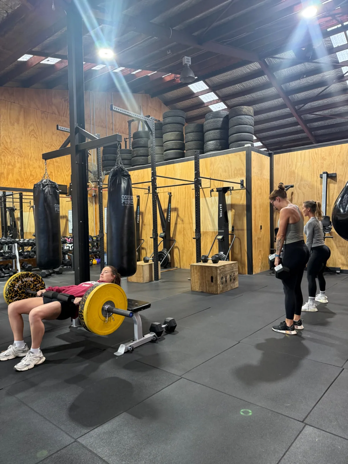 Barbell back squat with bumper plates in Functional Strength